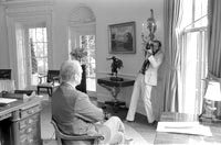 Photographer DAvid Kennerly takes an oval office photo of President Gerald R. Ford